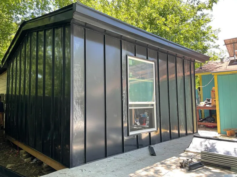 Black standing seam metal wall panels for Roof Inspection in Bostonia